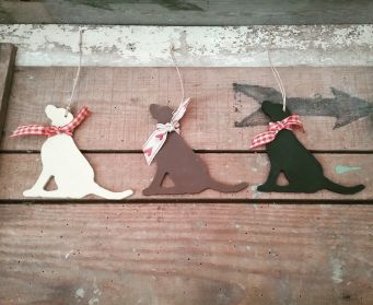 A Trio of Large Painted Hanging Labrador Decorations
